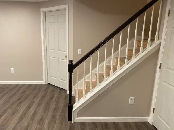 a basement staircase and closet door