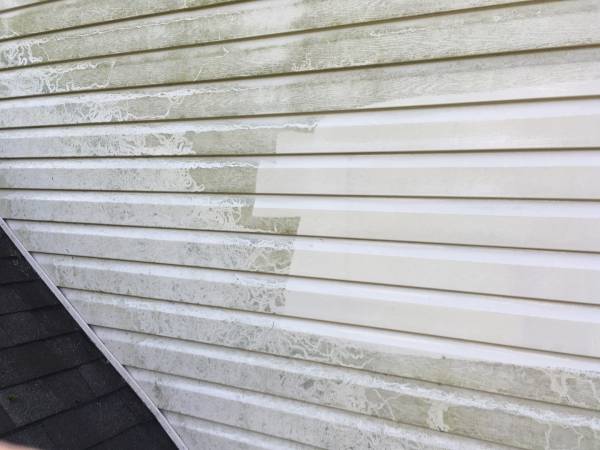 partially powerwashed siding on a home in Chester County, PA